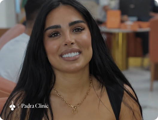 Female patient making a peace sign after treatment at Padra Clinic Kuwait