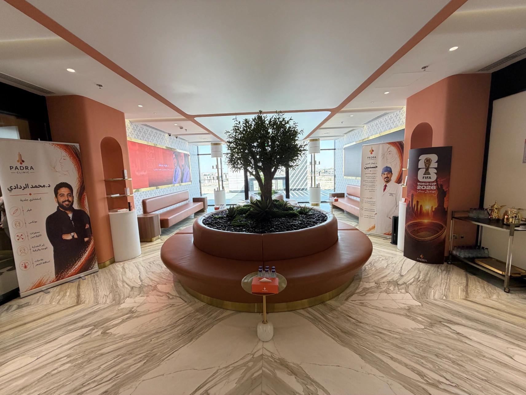 Spacious Padra Clinic waiting area with indoor greenery and doctor displays