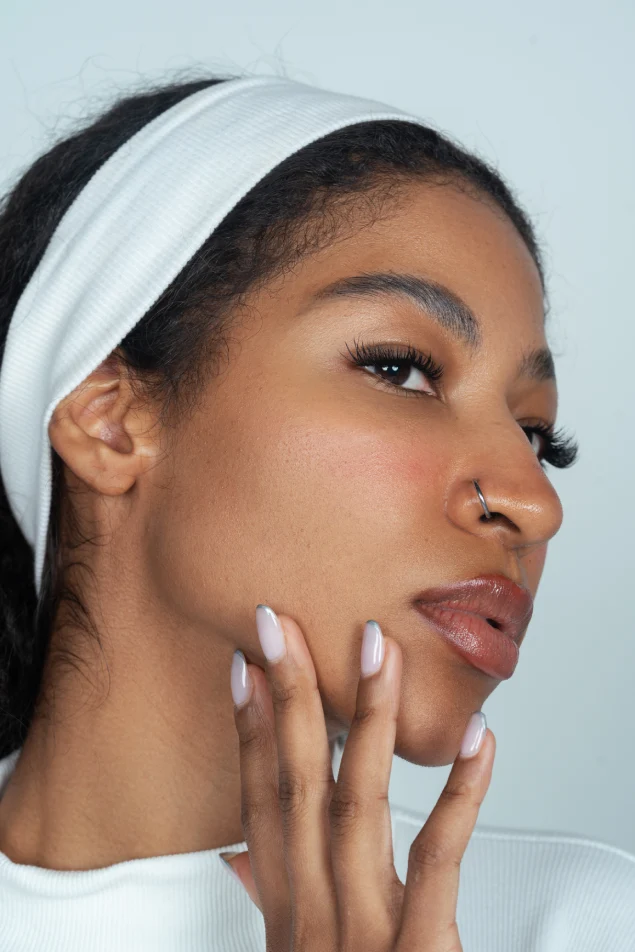 Close-up portrait of a woman highlighting her smooth skin and defined jawline at Padra Clinic